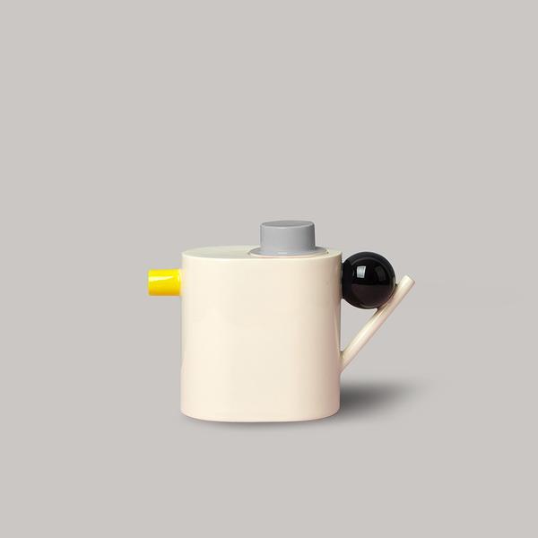 Zylinder Teapot by DesignK earthenware. Black Bal;l grey lid and yellow spoutt