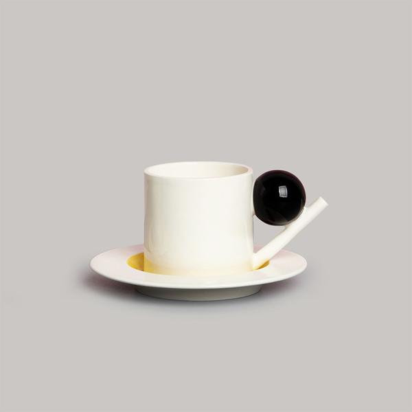 Kleiner Kreis Cup and Saucer by DesignK. Earthenware, white, black, yellow