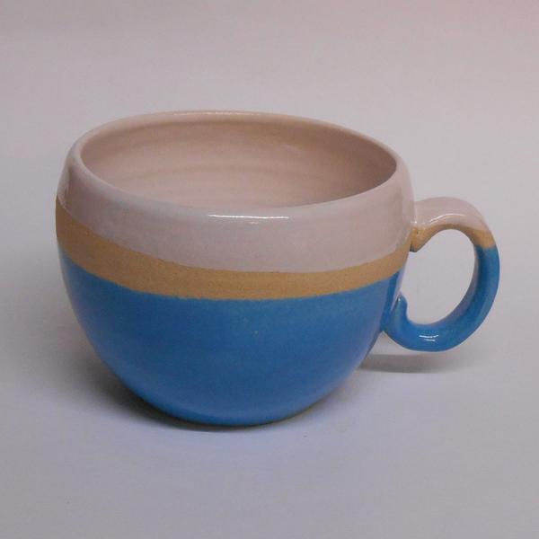 Huggable Neon Blue ceramic mug by Lesley McShea