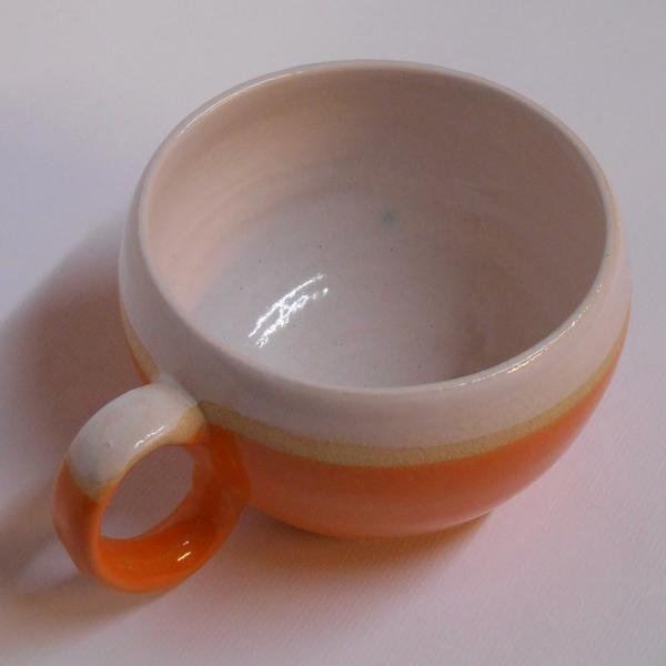 Huggable Orange ceramic mug by Lesley McShea