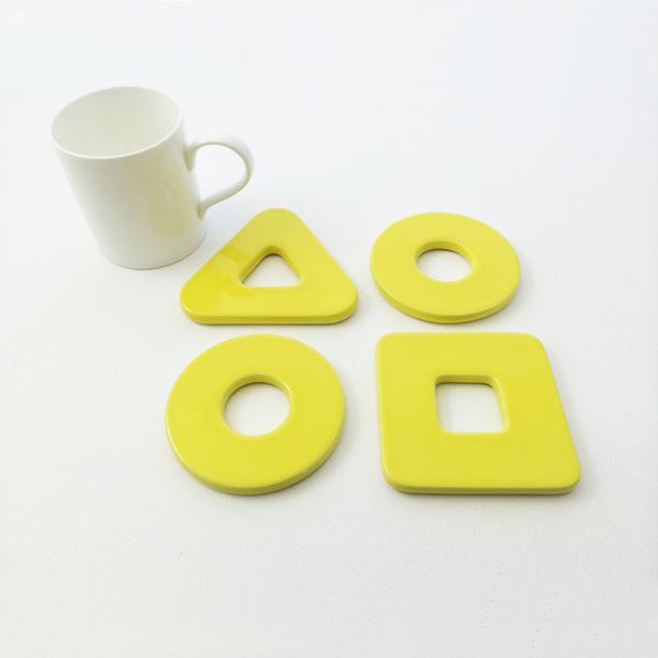 Primary coasters in yellow by Thelermont Hupton
