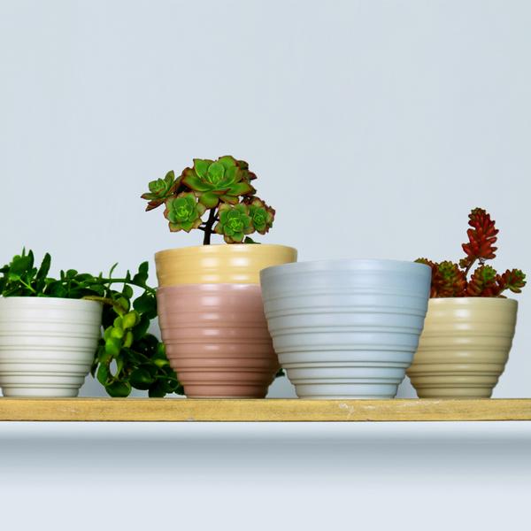 Lathed Planter by Harriet Caslin. Porcelain in white, grey, green, rose, peach